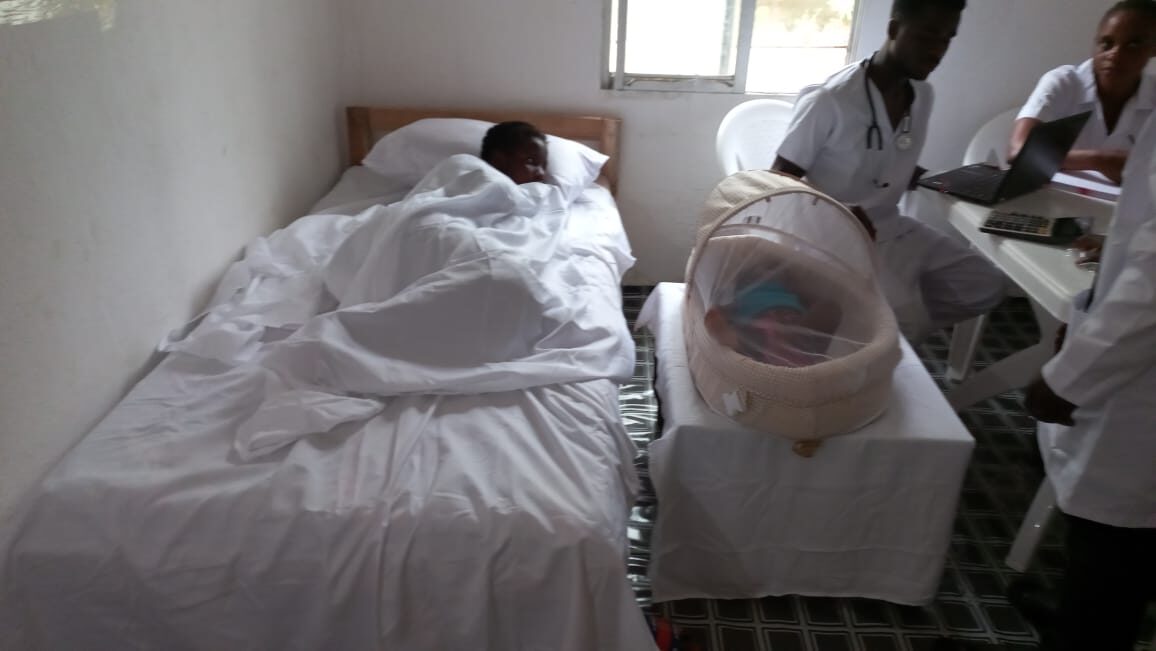 Mother and newborn resting in the maternal care clinic in Liberia